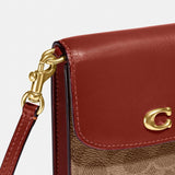 Coach Phone Crossbody In Signature Canvas in Tan Rust