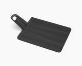 Joseph Joseph Chop2Pot™ Plus Black Folding Chopping Board Large in Black