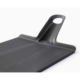 Joseph Joseph Chop2Pot™ Plus Black Folding Chopping Board Medium in Black