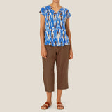 Masai Pallas Linen Trousers In Chestnut