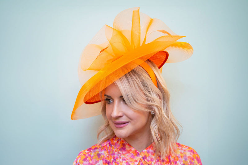 what colour fascinator with orange dress Qui prive designer orange dress Gasp Boutique
